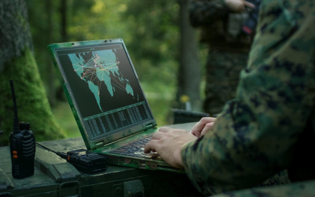 Man using GIS software in forest