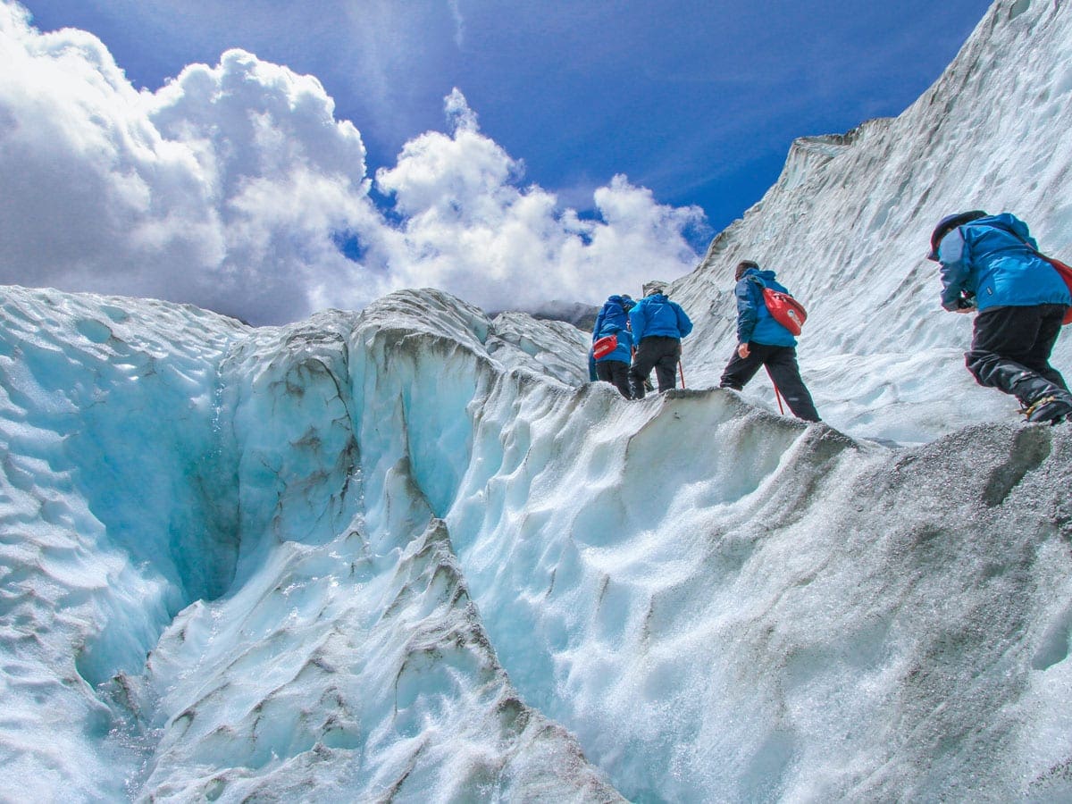 Students climb a glacier to represent potential ways career services can help students connect with employers.