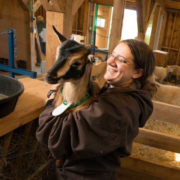 Woman holding goat