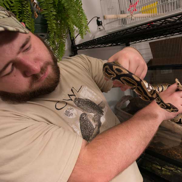 Man holding snake