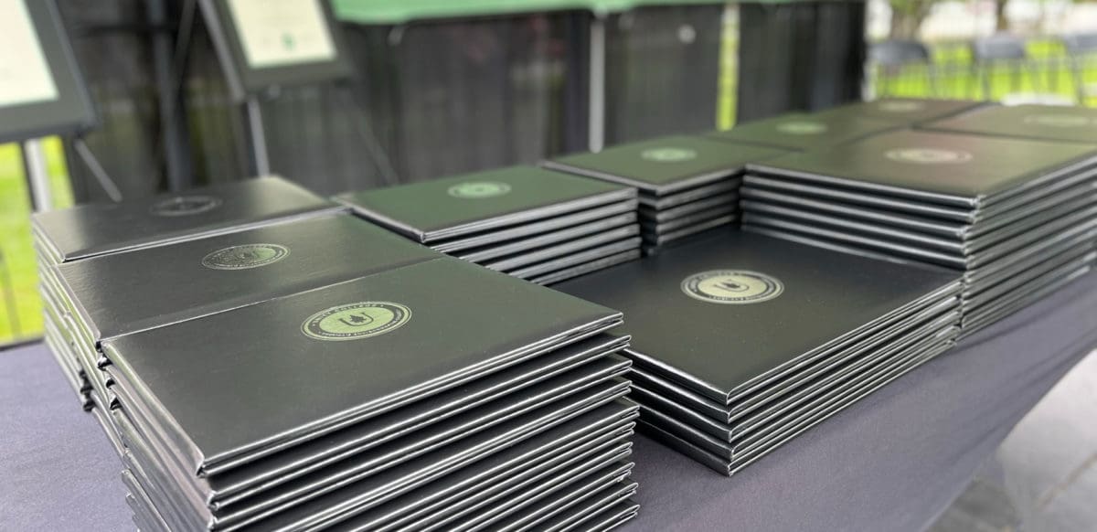 Unity Environmental University Commencement diploma covers