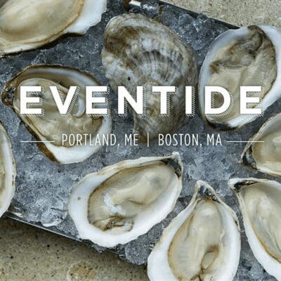 The word "Eventide" is writeen across a platter of raw oysters on a bed of ice.