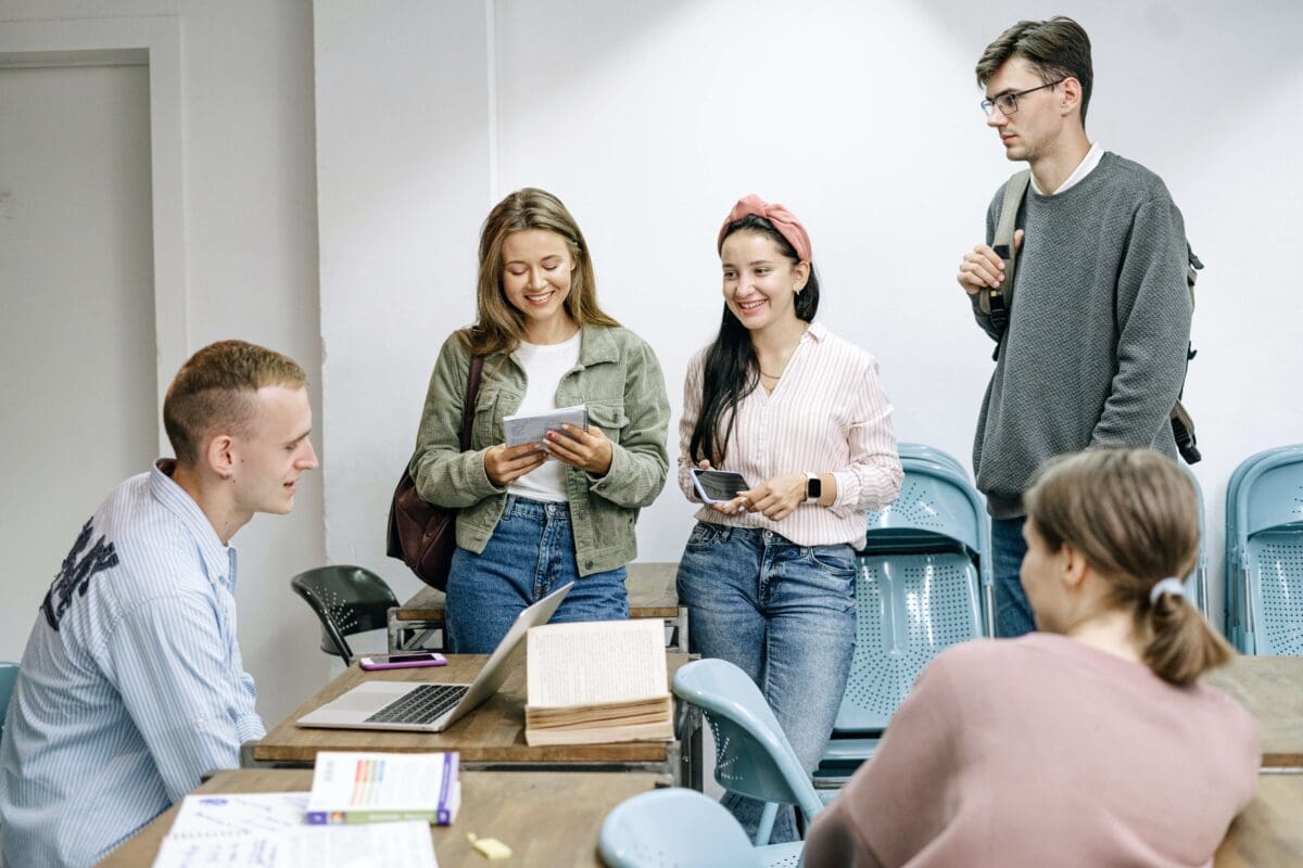grad students talking in a group after a class