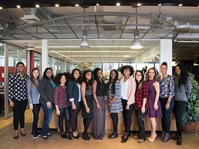Group of women standing for a photo.