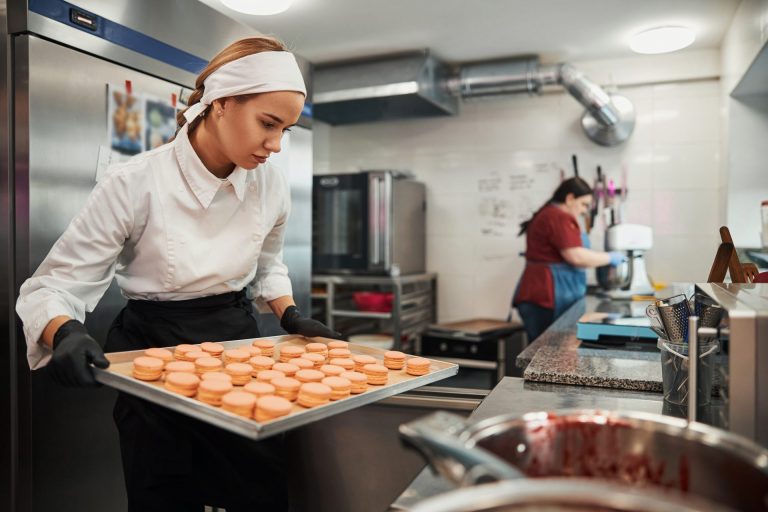 Focused pastry chef in the kitchen.