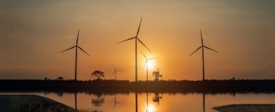 Wind Turbines Windmill Energy Farm. windmill wind turbines in field. Wind turbines power generator electric.