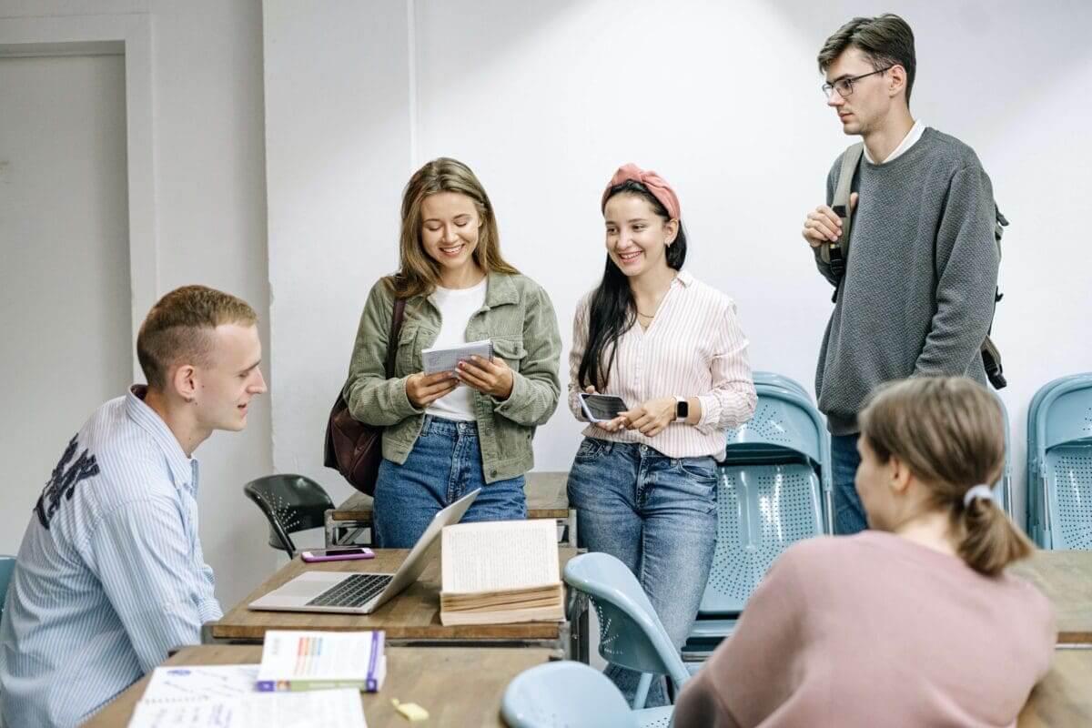 grad students talking in a group after a class