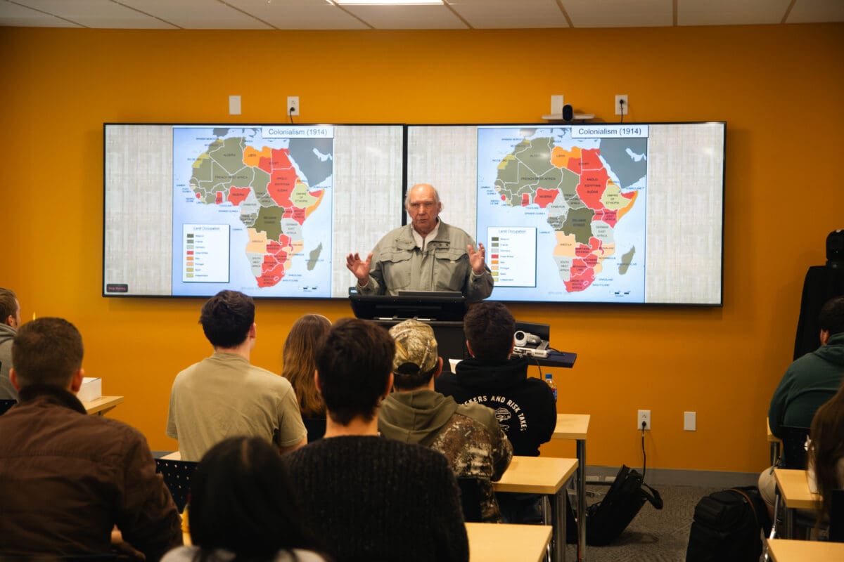 Professor Van Hoven presents in front of a classroom of Hybrid Learning students at Unity's New Gloucester campus.