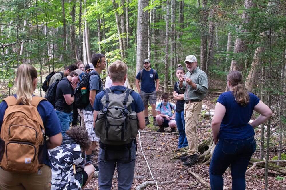 students engaging in an outdoor lecture