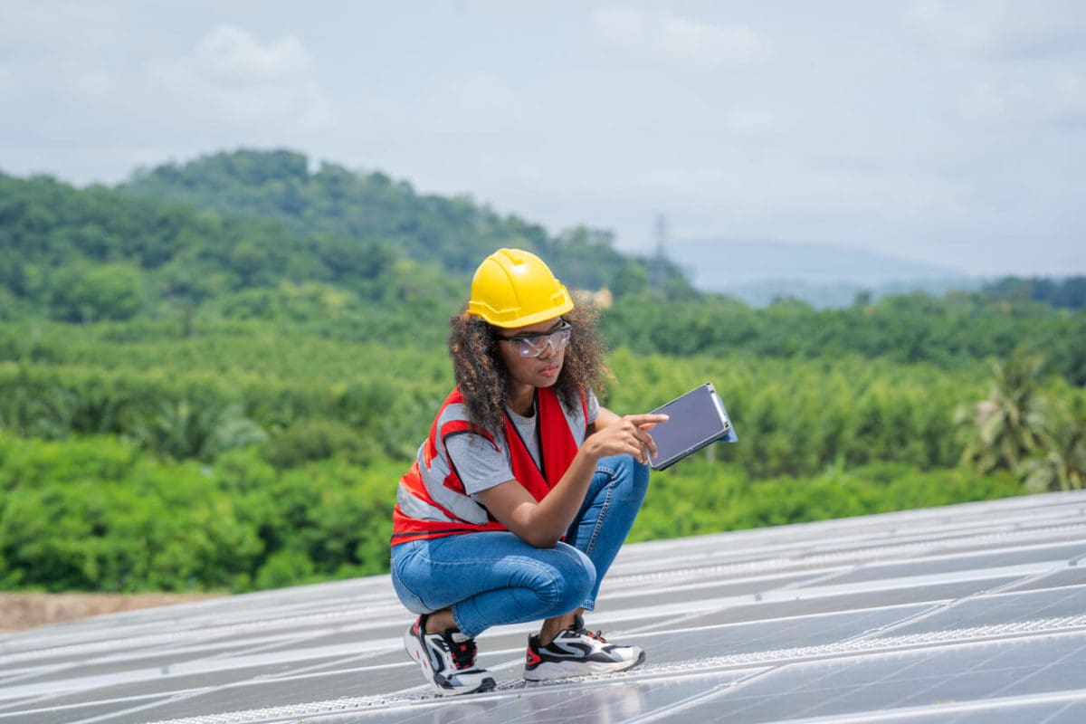 Environmental Manager Assessing Solar Panels