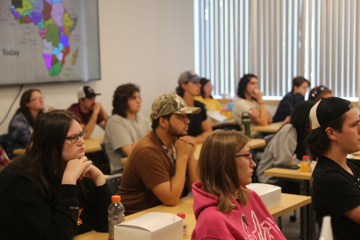 Students sit in a classroom at Unity's New Gloucester campus as they listen to Professor Von Hoven present.