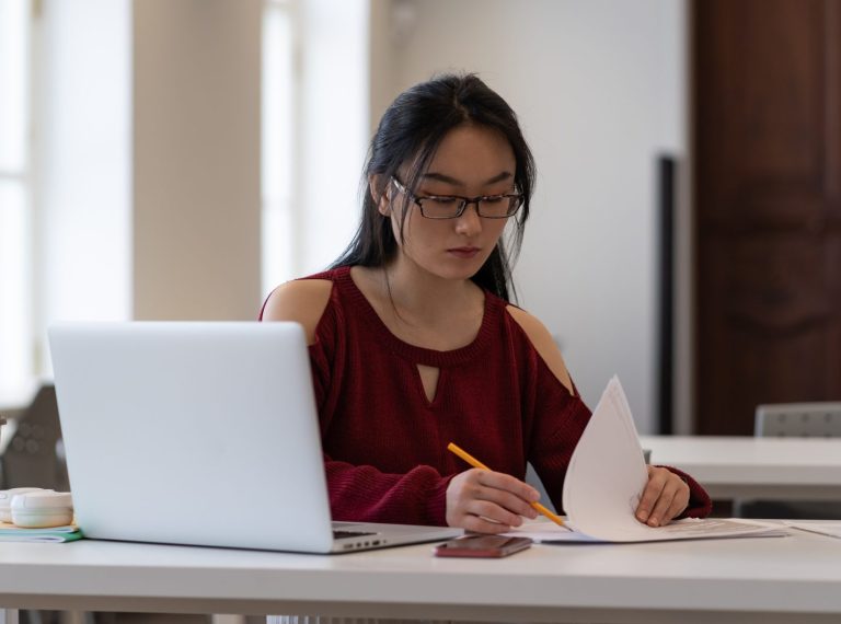 focused-asian-female-student-preparing-for-exam-or-2025-03-06-15-58-11-utc