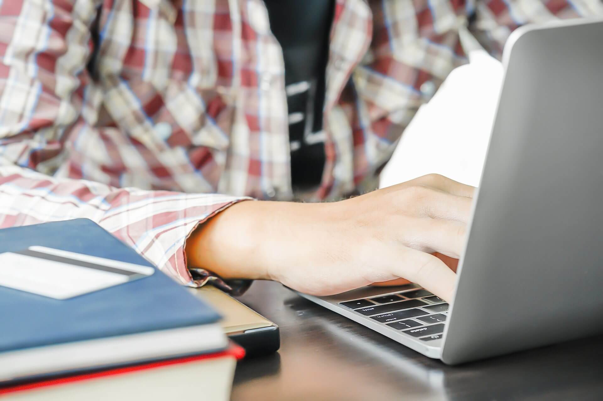 male-working-with-a-laptop-computer-on-the-table_-2025-01-24-05-15-16-utc