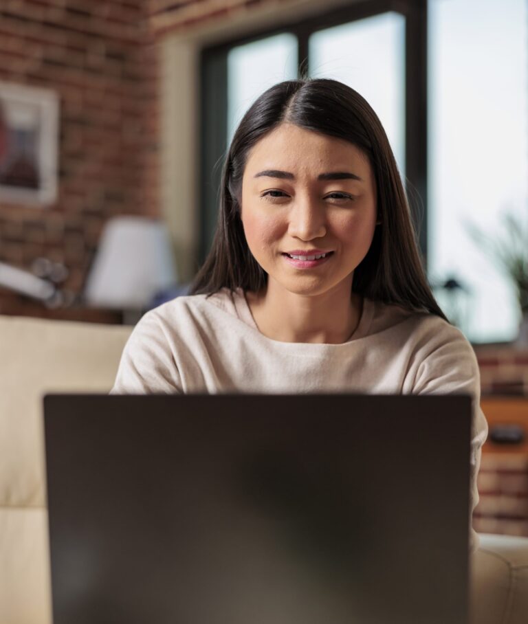 authentic-asian-young-woman-using-laptop-computer-2025-02-17-21-29-27-utc