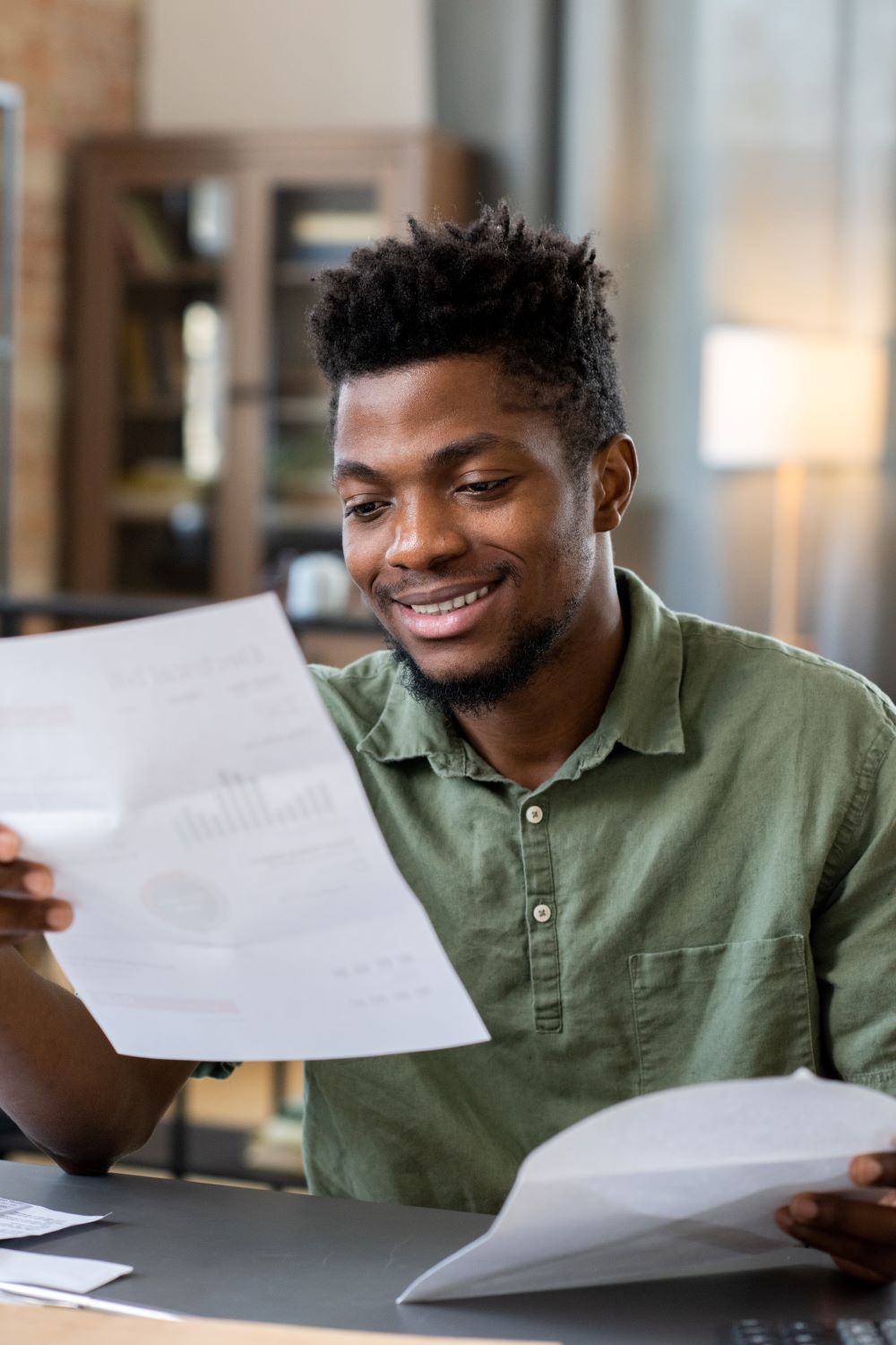 smiling-young-man-receiving-letter-2025-03-13-13-05-01-utc