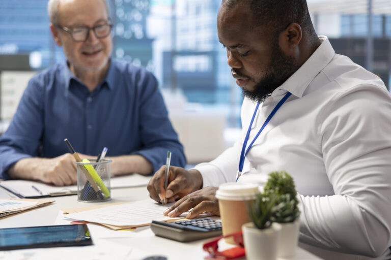 Financial advisor signing retirement plan contract at the end of the agreement